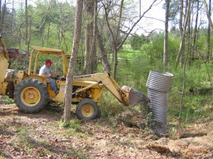 April 2006 - Leveling the stand-pipe with backhoe